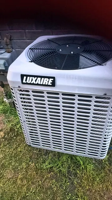 Central air conditioner condenser installed outdoors