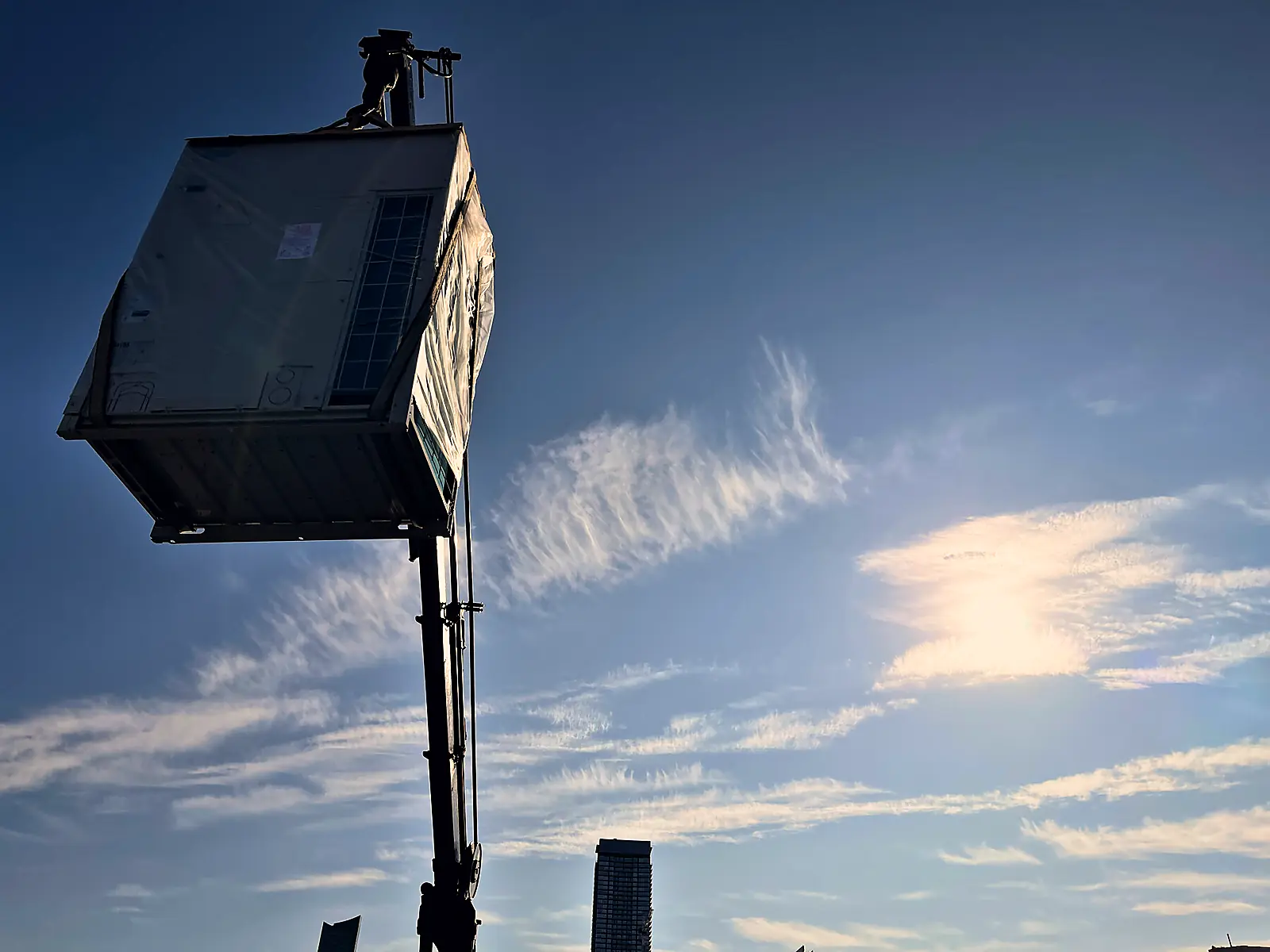Rooftop equipment by crane