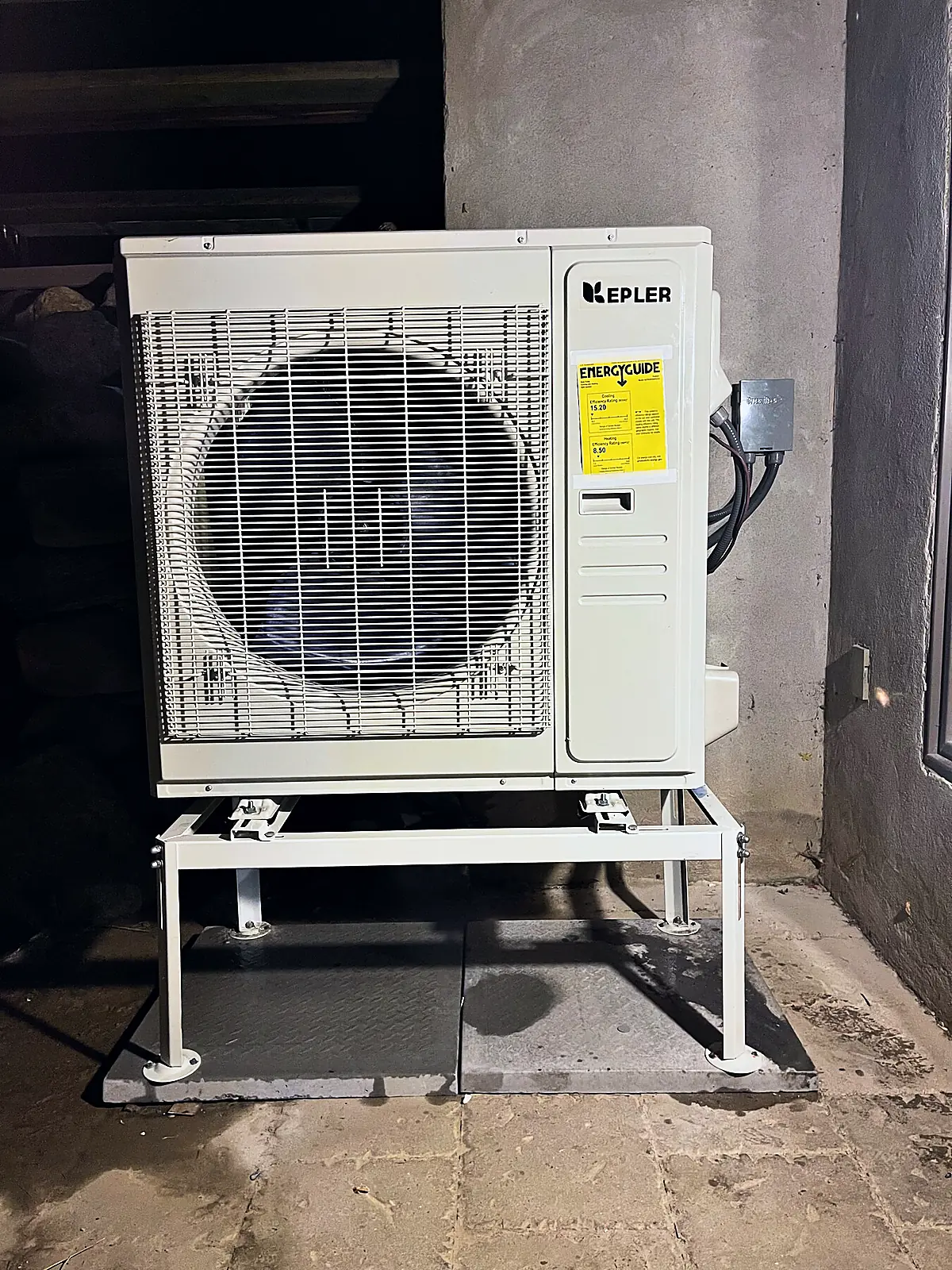 Heat pump on a wall stand