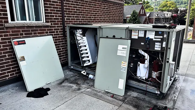 Rooftop unit with its panels removed for service