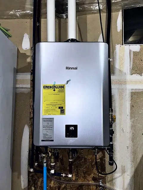 Tankless water heater with condensate and gas lines