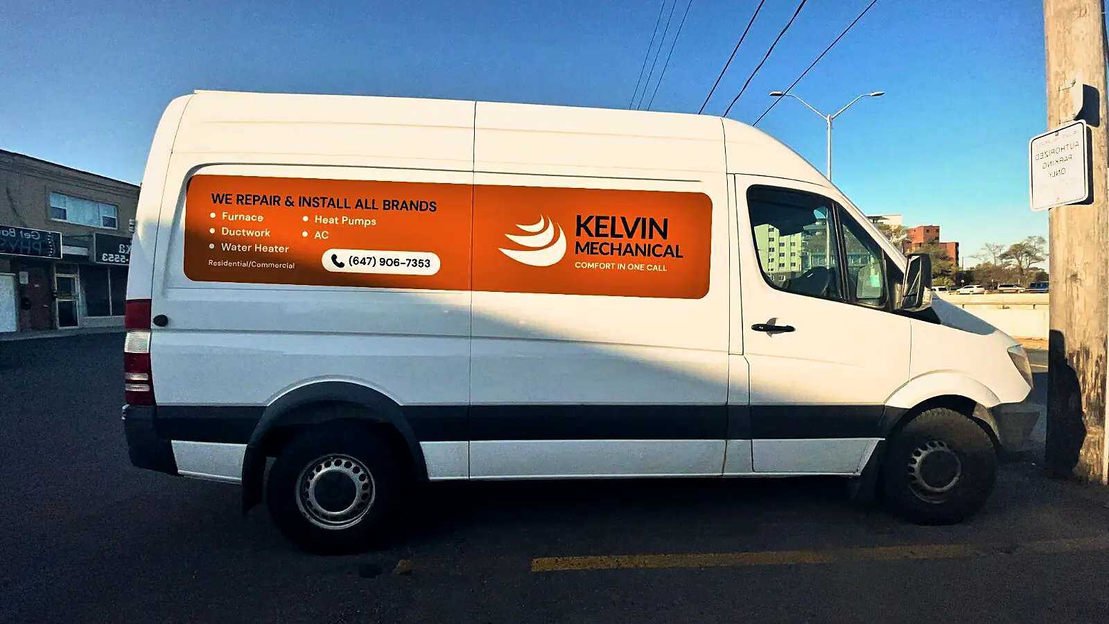 Kelvin Mechanical wrapped service van parked on a street